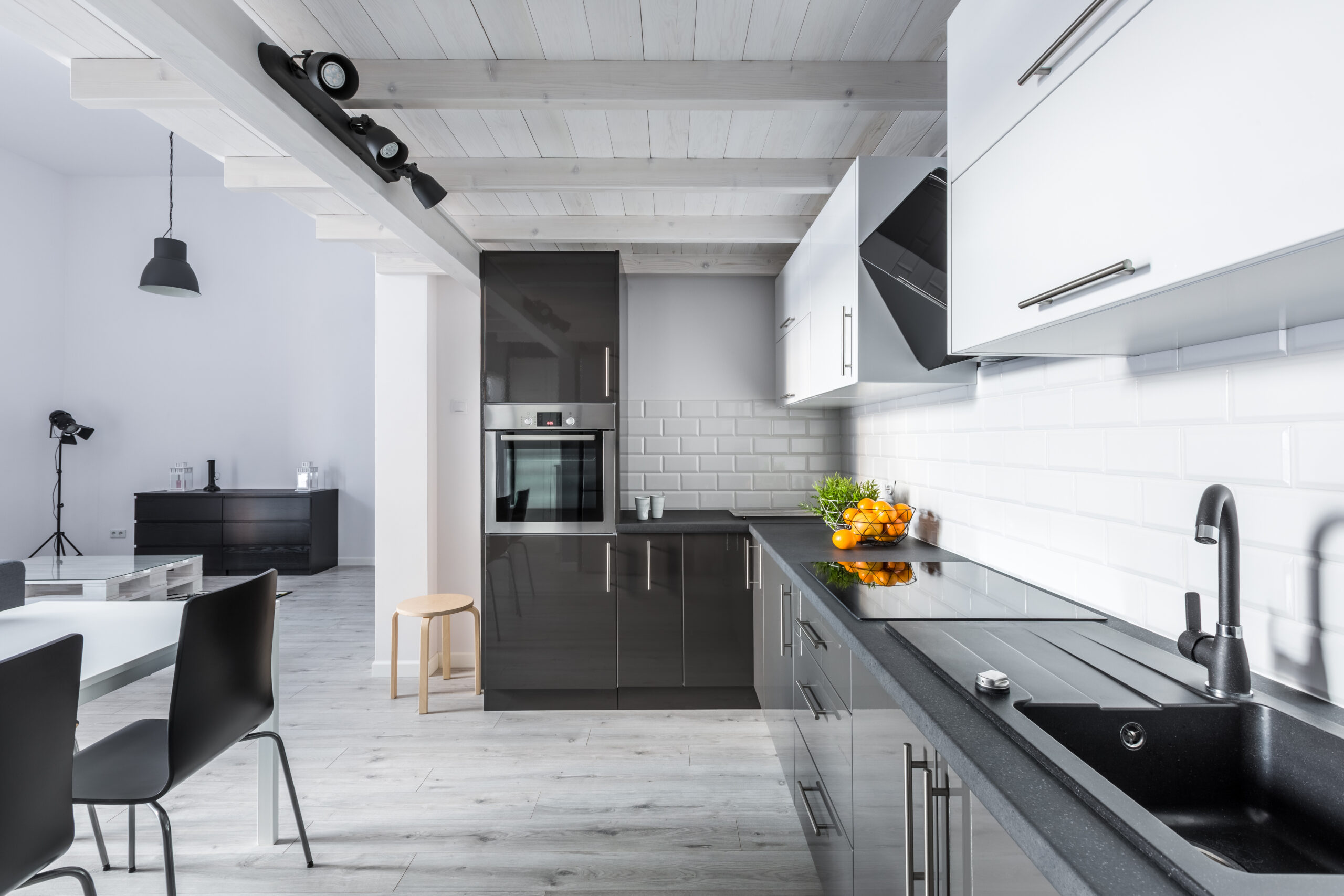 Modern kitchen with rustic ceiling